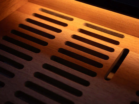 Luxury humidor styled in home office interior with ambient lighting